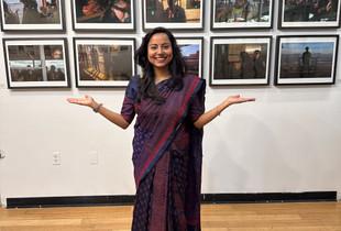 Photographer Debrani Das in front of her winning exhibition at the Women Street Photographer's show in New York.
