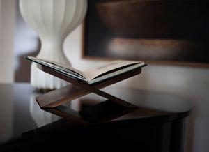 Custom made walnut stands, produced locally in Ottawa Canada beautifully display each Special Edition copy of TRANSFIGURATION.